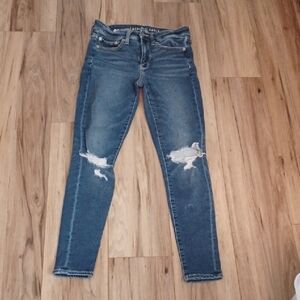 J1 - American Eagle Dark Blue Distressed Skinny Jeans. Size 4